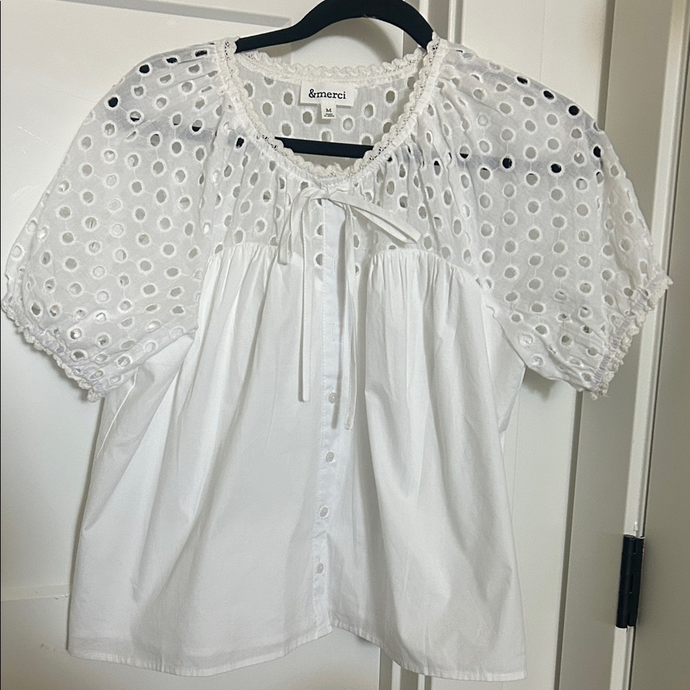 &merci Romantic White Eyelet Blouse
100 percent cotton. NWOT